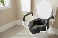 Load image into Gallery viewer, KMINA 4 Inch Soft Raised Toilet Seat with Handles and Lid, 220 lb Capacity, Fits Round & Compact Elongated Bowls up to 15" Wide, Tool-Free Clamp-On Riser, Black