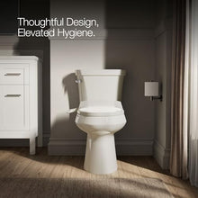 Load image into Gallery viewer, Kohler PureWash M250 Manual Elongated Bidet Toilet Seat, Biscuit, Quiet-Close Lid Prevents Slamming, Cool Water, Easy Installation with Quick-Release Hinges, Adjustable Spray Position & Pressure