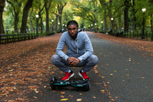 Load image into Gallery viewer, Electric Hoverboard - 7MPH Top Speed, 6 Mile Range, Long Lasting Li-Ion Battery - 5HR Full Charge, Built-In Bluetooth Speaker